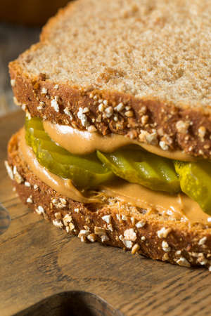 Homemade Peanut Butter and Pickle Sandwich with Chipsの写真素材