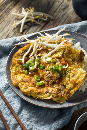 Homemade Chinese Egg Foo Yung Omelette with Riceの写真素材