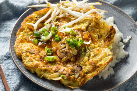 Homemade Chinese Egg Foo Yung Omelette with Riceの写真素材