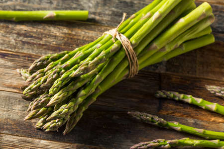 Raw Organic Green Asparagus Ready to Cookの写真素材