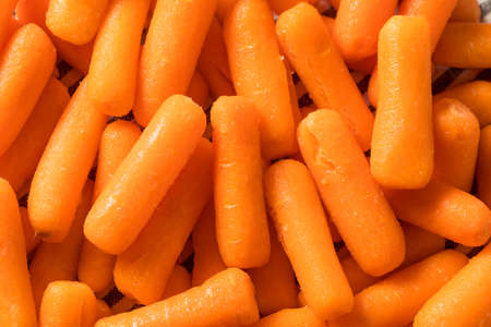 Raw Organic  Baby Carrots in a Bowlの写真素材