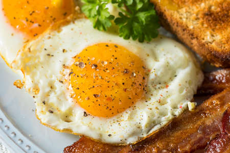 Homemade Sunnyside Eggs Breakfast with Toast and Bacon