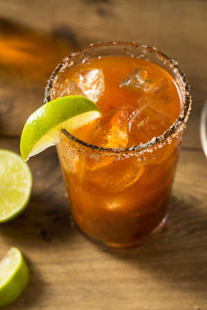 Homemade Mexican Michelada Beer Cocktail with Limeの写真素材