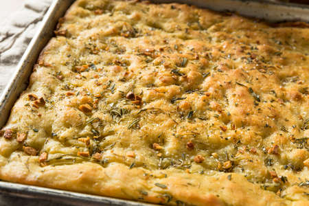 Homemade Garlic and Rosemary Focaccia Bread with Olive Oilの写真素材