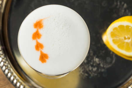Sweet Boozy Whiskey Pisco Sour with Lemon and Angastora