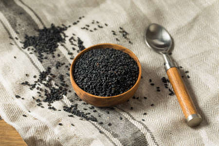 Raw Dry Organic Black Sesame Seeds in a Bowlの写真素材