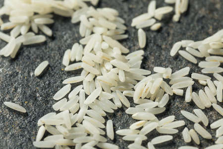 Dry White Long Grain Jasmine Rice in a Spoonの写真素材