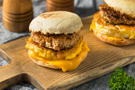 Homemade Breakfast Sausage Patty Sandwich with Eggs and Cheeseの写真素材