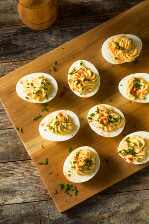 Cooked Organic Hard Boiled Eggs with Chives and Paprikaの写真素材