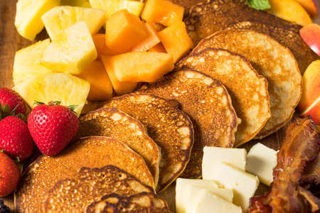 Homemade Pancake Charcuterie Board with Fruit and Baconの写真素材