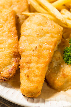 Homemade British Fish and Chips with Tartar and Lemonの写真素材