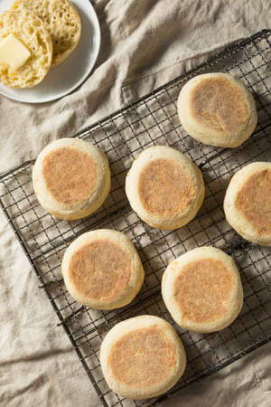 Homemade Toasted English Muffins with a Tab of Butterの写真素材