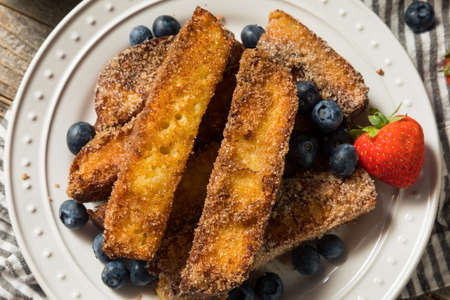 Homemade French Toasts Sticks with Syrup and Fruit