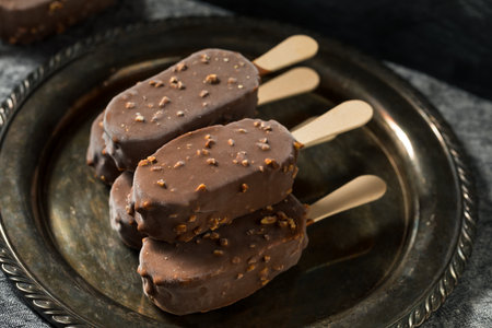 Frozen Chocolate Covered Ice Cream Bars with Nutsの写真素材