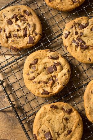 Warm Homemade Chocolate Chip Cookies on a Cooling Rack