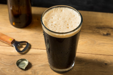 Refreshing Boozy Dark Stout Beer in a Pint Glass