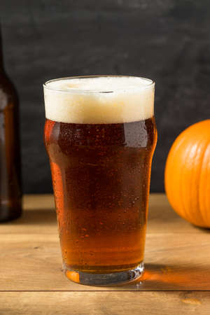 Cold Refreshing Pumpkin Ale Beer in a Pint Glassの写真素材
