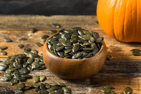 Homemade Green Pumpkin Seeds in a Bowlの写真素材
