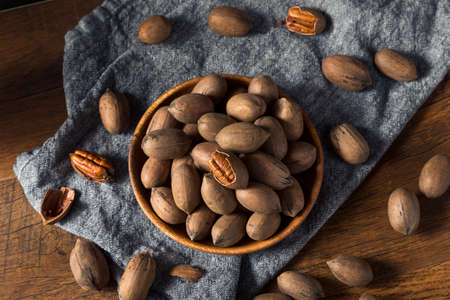 Raw Organic Whole Pecan Nuts in a Bowl