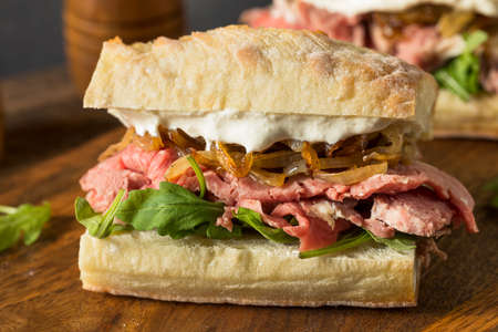 Homemade Prime Rib Sandwich Au Jus with Onionsの写真素材