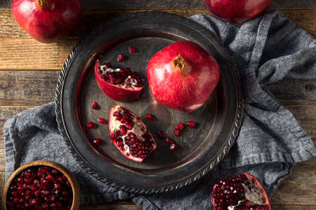 Raw Red Organic Pomegranate Seeds Ready to Eatの写真素材