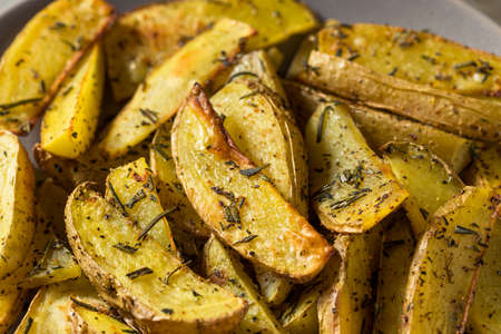 Homemade Organic Rosemary Potato Wedges with Salt and Pepperの写真素材