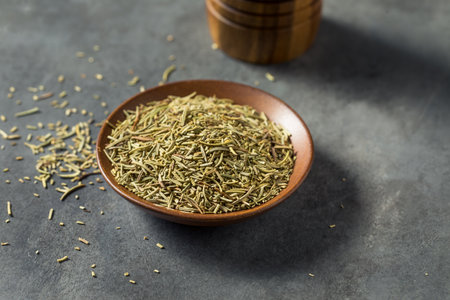 Raw Dry Organic Rosemary Spices in a Bowlの写真素材
