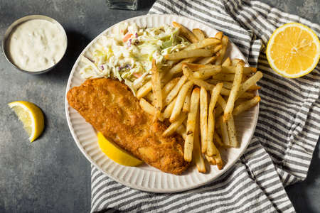 Homemade Fried Fish Dinner with Coleslaw and French Friesの写真素材