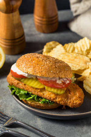 Homemade Crispy Fried Fish Fillet Sandwich with Chipsの写真素材