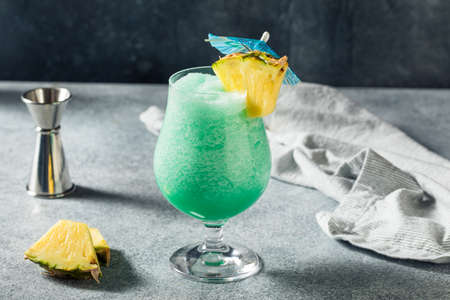 Boozy Refreshing Frozen Blue Hawaii Cocktail with Pineapple and Rum