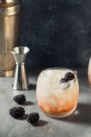 Boozy Refreshing Bramble Cocktail with Gin and Blackberriesの写真素材