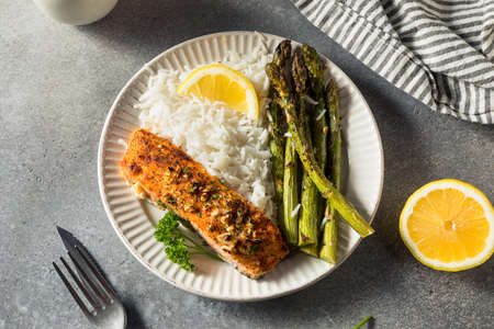 Healthy Homemade Roasted Salmon with Asparagus with Riceの写真素材