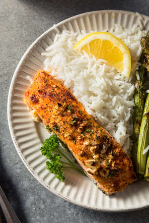 Healthy Homemade Roasted Salmon with Asparagus with Riceの写真素材