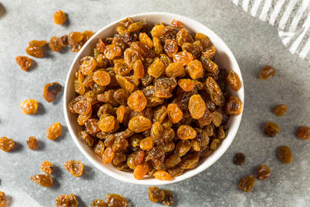 Healthy Organic Golden Raisins in a Bowlの写真素材