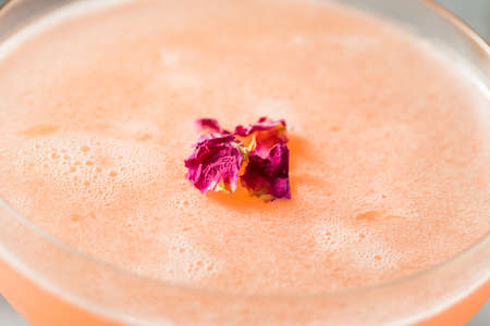 Cold Refreshing Rose Petal Cocktail with Gin and Lemonの写真素材