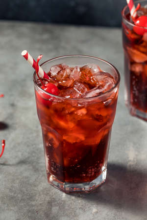 Cold Refreshing Cherry Cola in a Glass with Iceの写真素材