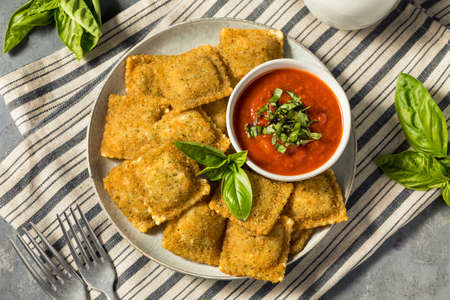 Homemade Fried Raviolis with Basil and Marinara Sauceの写真素材