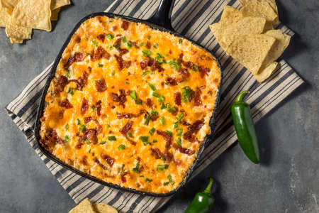 Homemade Spicy Jalapeno Popper Dip with Bacon and Chipsの写真素材