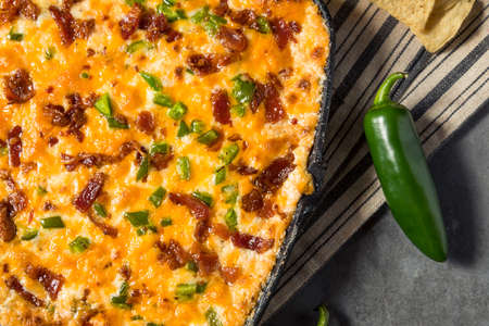 Homemade Spicy Jalapeno Popper Dip with Bacon and Chipsの写真素材