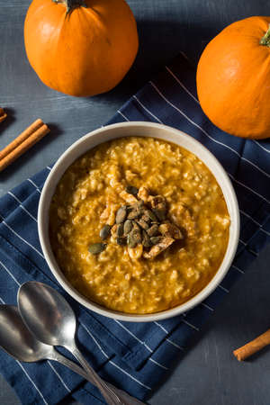Healthy Homemade Autumn Pumpkin Spice Oatmeal with Maple Syrupの写真素材
