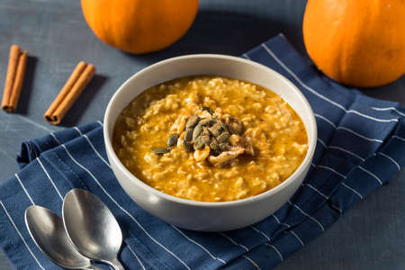 Healthy Homemade Autumn Pumpkin Spice Oatmeal with Maple Syrupの写真素材