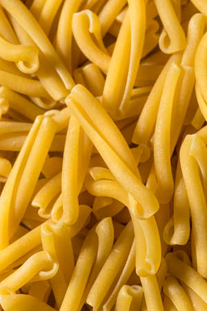 Healthy Dry Casarecce Pasta in a Bowlの写真素材