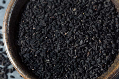 Raw Black Organic Charnushka Onion Seed Spice in a Bowlの写真素材