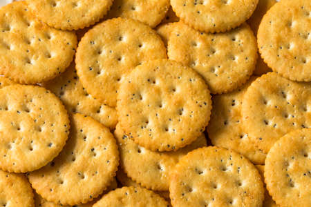 Healthy Brown Round Whole Wheat Crackers on a Platterの写真素材