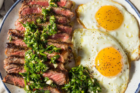 Homemade American Steak and Eggs Breakfast with Parsley and Saltの写真素材