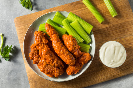 Homemade Buffalo Chicken Tenders with Celery and Blue Cheeseの写真素材