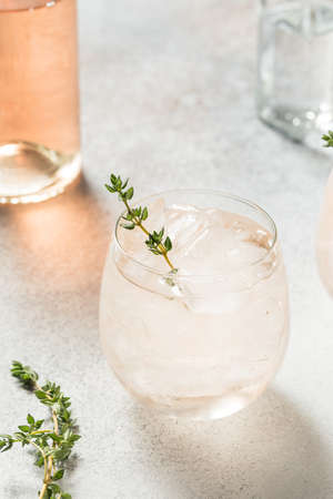 Boozy Pink Rose Wine Spritzer with Ice and Thymeの写真素材