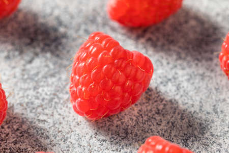 Raw Red Organic Raspberries in a Bowl