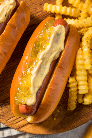 Homemade Gourmet Hot Dogs with Mustard and French Friesの写真素材