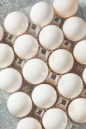 Raw Organic Cage Free White Eggs in a Groupの写真素材